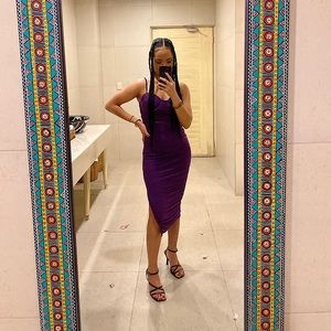 Purple mesh dress, ruched to snatch the waist and booty.